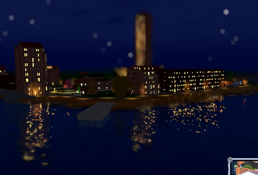 Le front de mer la nuit, les lumières de la ville se reflètent dans l'eau
